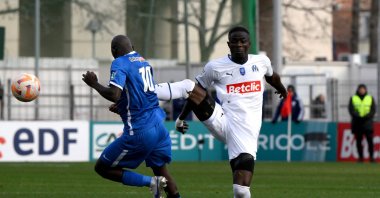 Marseille's Eric Bailly (R) fouls Hyeres' Almike Moussa N'Diaye during the French Cup round of 64 match between Olympique de Marseille and Hyeres, at the Francis-Turcan Stadium, in Martigues, France, Jan. 7, 2023. (AFP Photo)