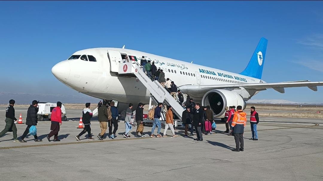 Irregular Afghan migrants board a plane for deportation, in Ağrı, eastern Türkiye, Jan. 1, 2023. (AA Photo)
