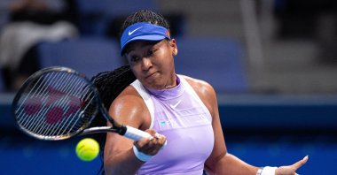 Naomi Osaka of Japan hits a return against Daria Saville of Australia during their women's singles match on day two of the Pan Pacific Open tennis tournament, Tokyo, Japan, Sept. 20, 2022. (AFP)