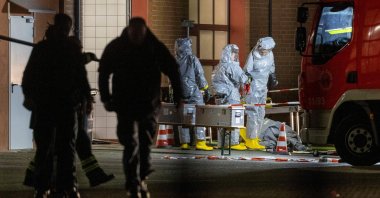 Agents wearing protective suits examine substances on the premises of the fire brigade in Castrop-Rauxel, western Germany, Jan. 8, 2023. (AFP Photo)