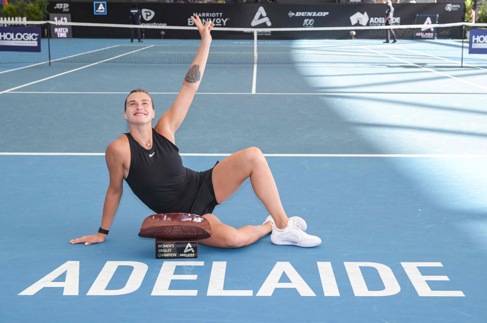 Belarusian tennis player Aryna Sabalenka celebrates with the trophy after winning her final match against Czech Linda Noskova at the WTA Adelaide International tournament, Adelaide, Australia, Jan. 8, 2023. (AFP Photo)