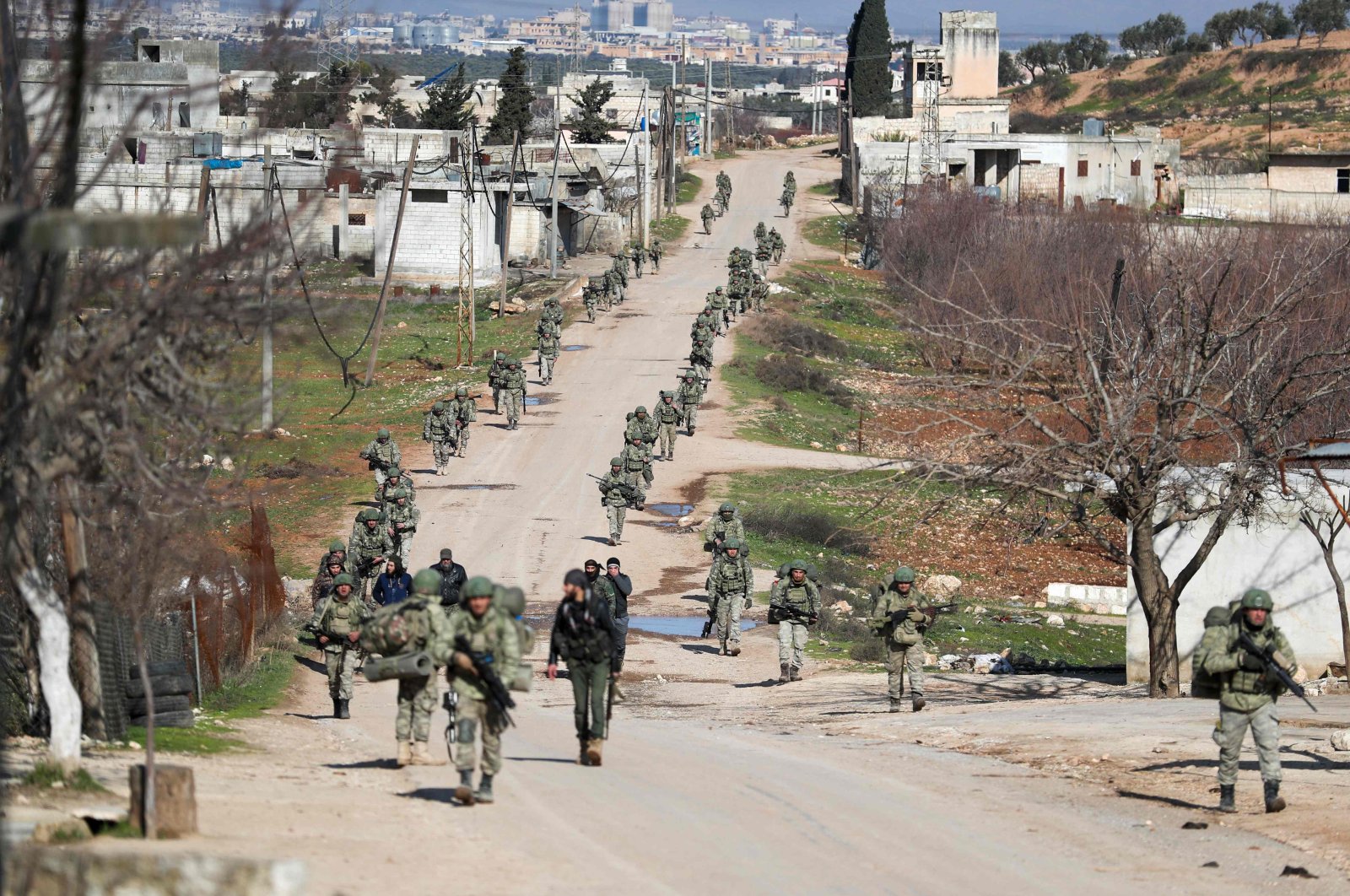 Turkish soldiers patrol a village southeast of Idlib, Syria, Feb. 10, 2020. (AFP Photo)