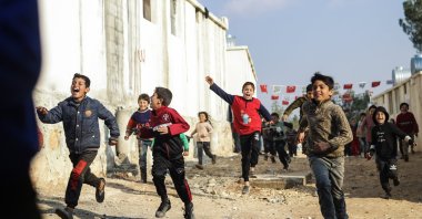 Syrian children play in front of the newly built briquette houses in northern Afrin province, Syria, Jan. 7, 2023 (AA Photo)