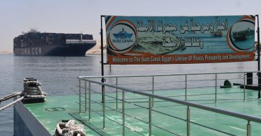 A welcoming sign is placed on the shore of the Suez Canal in the northeastern Egyptian city of Ismailia, Egypt, May 27, 2021. (AFP Photo)