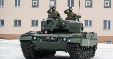 Czech soldiers salute from a Leopard 2A4 tank during a ceremony for the hand over of the symbolic key of the tank to the Czech army, in Praslavice, Czech Republic, Dec. 21, 2022. (EPA Photo)
