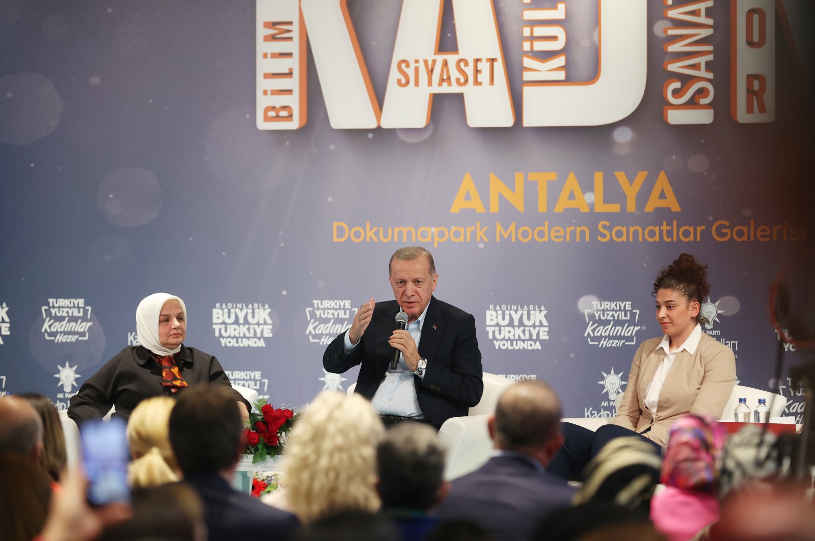 President Recep Tayyip Erdoğan (C), the ruling Justice and Development Party&#039;s (AK Party) chairperson, speaks at the “Marching to Great Türkiye with Women: Women in Science, Culture, Art, Sports and Politics Convention” in southern Antalya province, Türkiye, Dec. 7, 2022. (AA Photo)