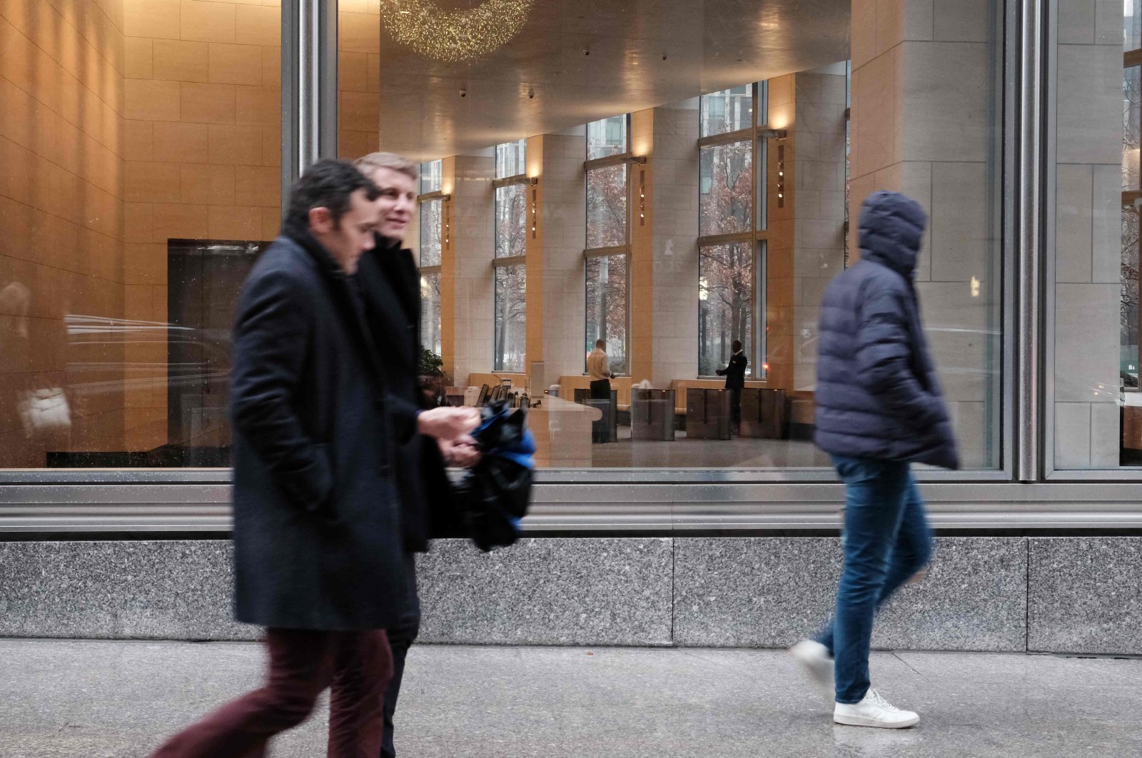 People walk by Goldman Sachs headquarters in Manhattan, New York City, U.S., Dec. 16, 2022. (AFP Photo)