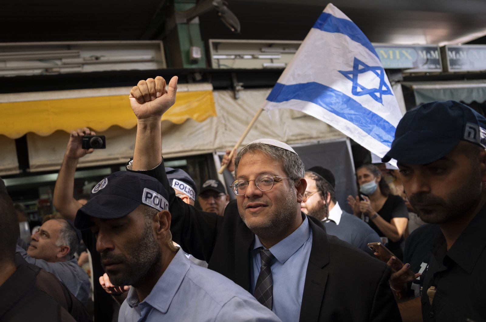 Israeli far-right lawmaker Itamar Ben-Gvir visits at Hatikva Market, Tel Aviv, Israel, Oct. 21, 2022. (AP Photo)