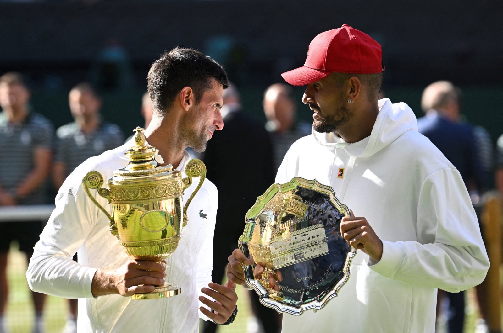 Serbia&#039;s Novak Djokovic poses with the trophy after winning the Wimbledon men&#039;s singles final alongside runner up Australia&#039;s Nick Kyrgios, London, U.K., July 2022. (Reuters Photo)