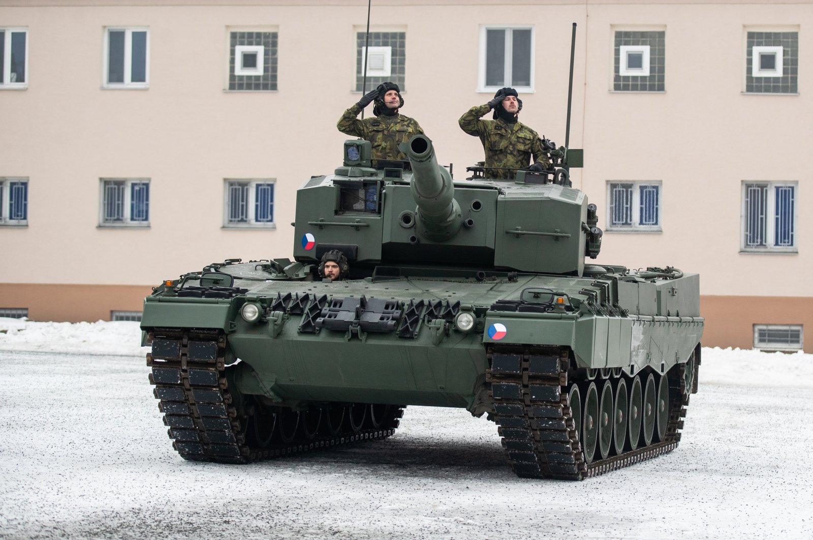Czech soldiers salute from a Leopard 2A4 tank during a ceremony for the hand over of the symbolic key of the tank to the Czech army, in Praslavice, Czech Republic, Dec. 21, 2022. (EPA Photo)