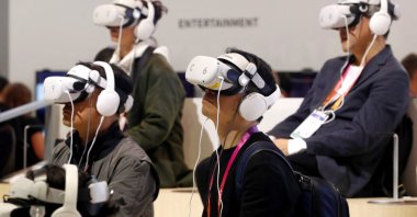 CES attendees attend a virtual reality concert at the Lotte Data Communications booth, during CES 2023 at the Las Vegas Convention Center, in Las Vegas, U.S., Jan. 6, 2023. (Reuters Photo)