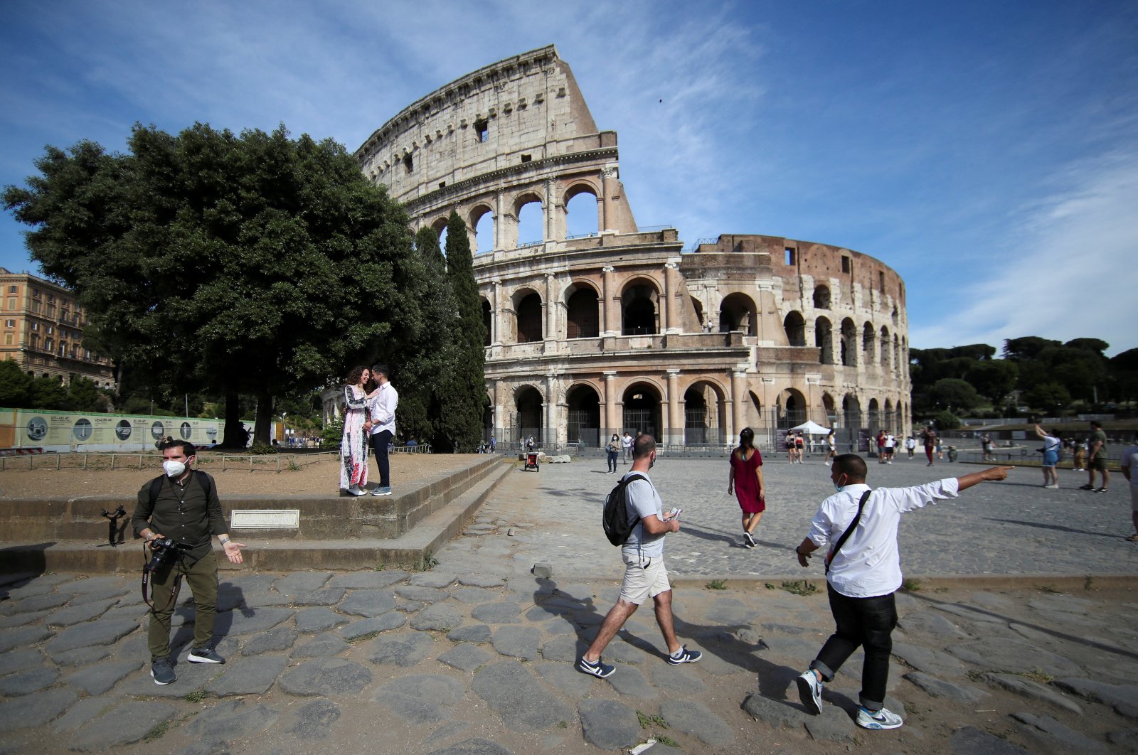 People walk outside the Colosseum, Rome, Italy, June 4, 2021. (Reuters Photo)