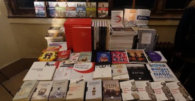 Some of the books published by Kızılay Culture &amp; Arts Publications displayed in the press meeting, Istanbul, Türkiye, Jan. 10, 2023. (AA Photo)