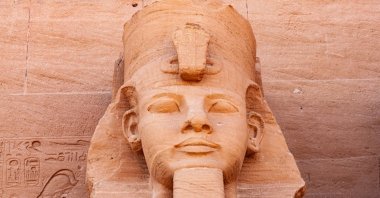 The statue of pharaoh Ramses II in front of the Great Temple of Ramses II in the village of Abu Simbel, Aswan, Upper Egypt. (Shutterstock Photo)
