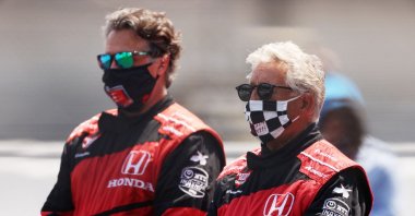 Mario Andretti and his son Michael stands on the grid prior to the 104th running of the Indianapolis 500 at Indianapolis Motor Speedway in Indianapolis, Indiana, US., Aug.23, 2020. (AFP Photo)