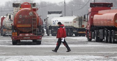 Fuel tankers stand at a parking lot of the Gazprom Neft MNPZ Moscow Petroleum Refinery JSC in Moscow, Russia, Dec. 30, 2022. (EPA Photo)