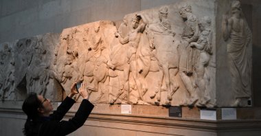 Visitors view the Parthenon Marbles, also known as the Elgin Marbles, at the British Museum in London on Jan. 9, 2023. (AFP Photo)