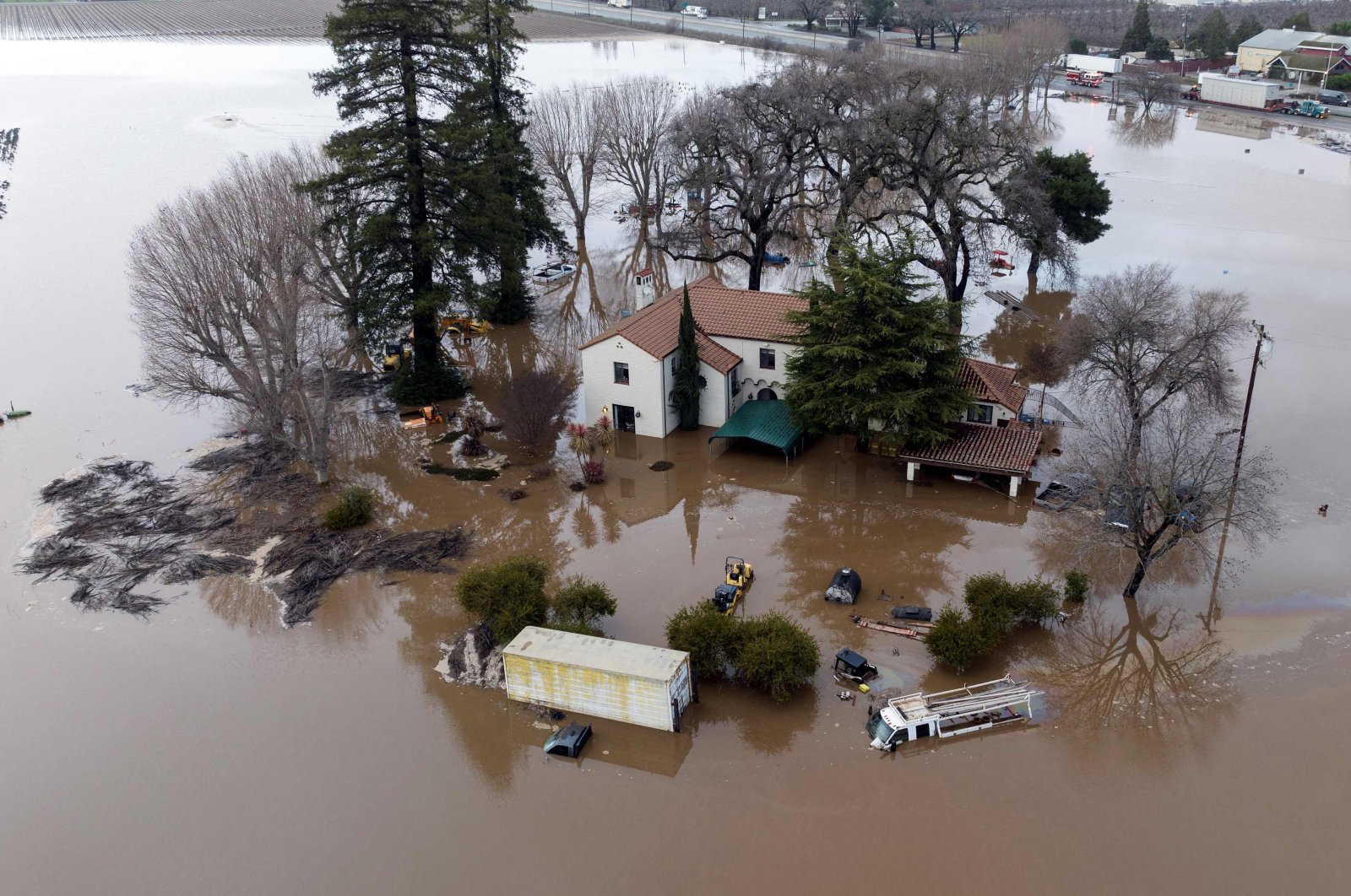 This aerial view shows a flooded home partially underwater in Gilroy, California, U.S., Jan. 9, 2023. (AFP Photo)