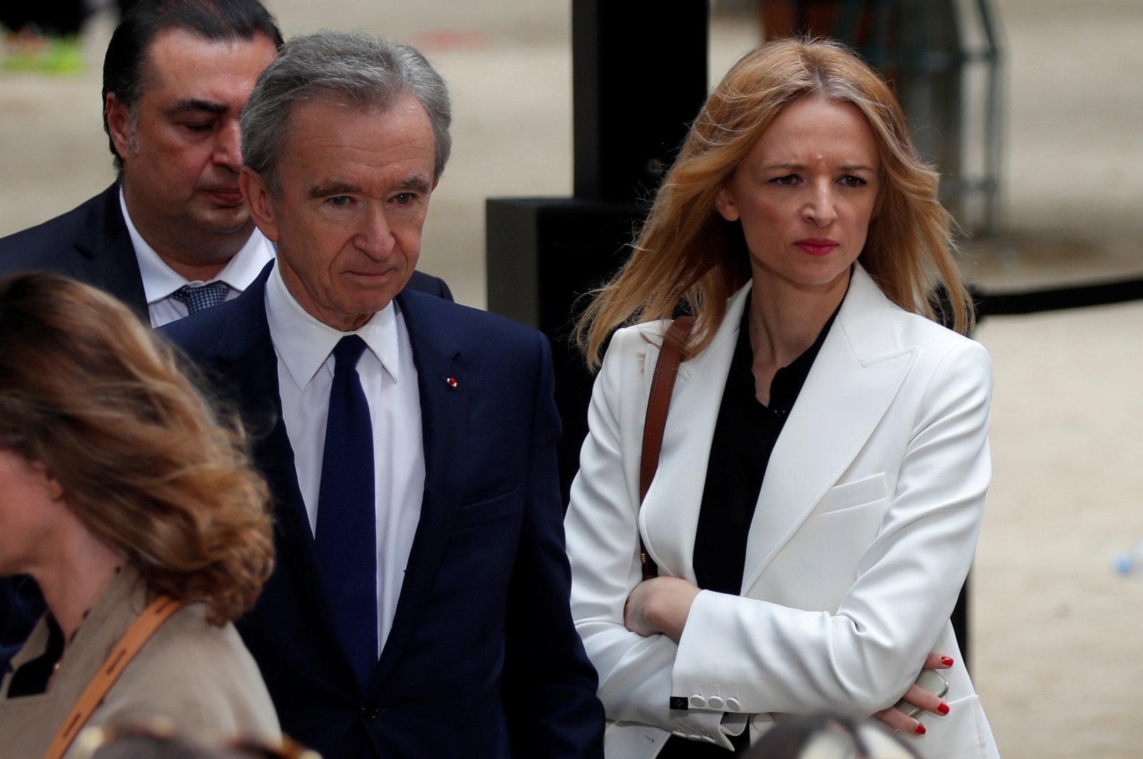 Bernard Arnault (L), CEO of LVMH Moet Hennessy Louis Vuitton SE, and Delphine Arnault (R), Executive Vice President of Louis Vuitton, leave after the Spring/Summer 2020 collection show for fashion house Louis Vuitton during Men&#039;s Fashion Week in Paris, France, June 20, 2019. (Reuters Photo)
