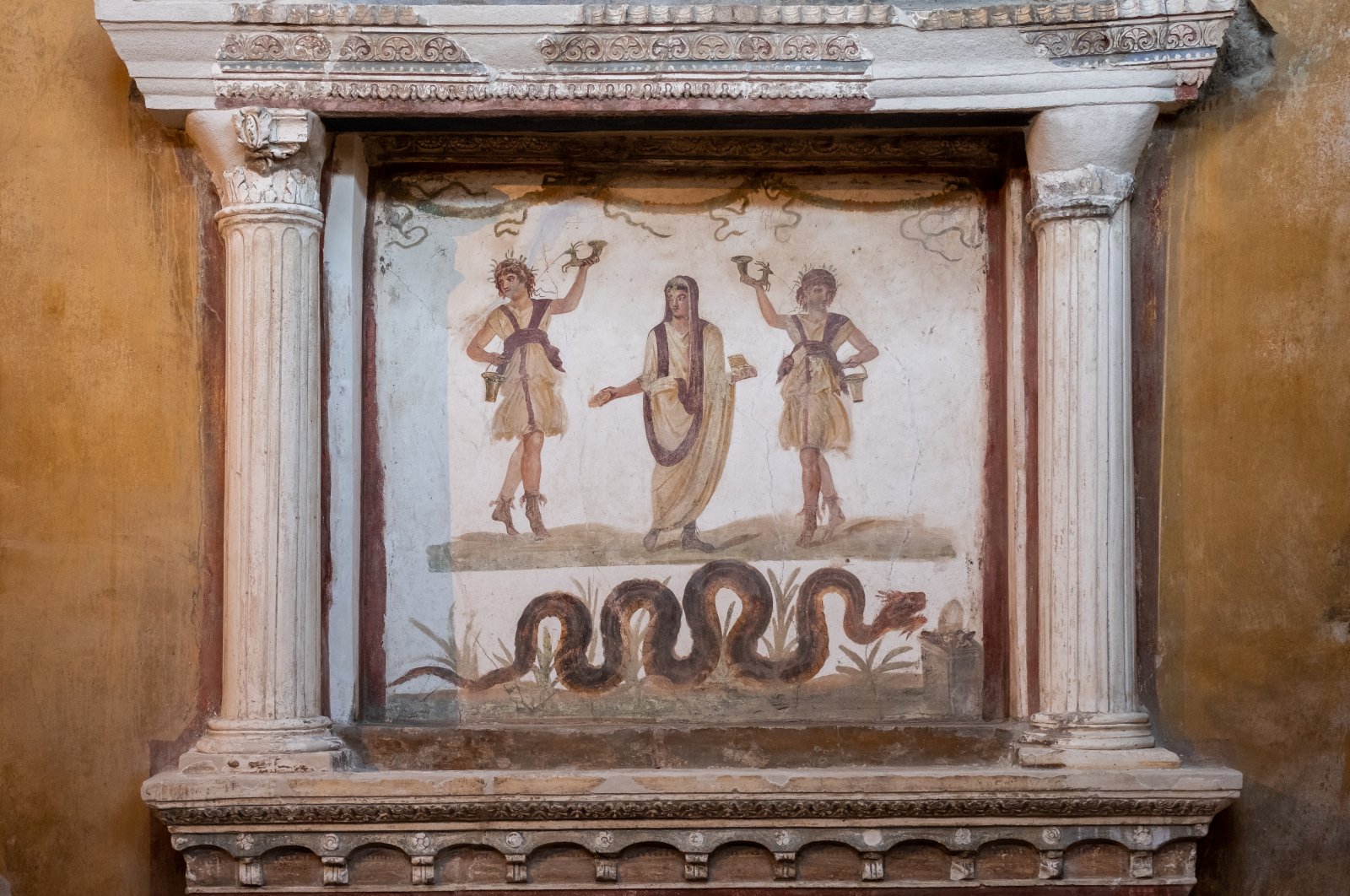 The Hall of Pentheus, a fresco depicts Hercules as a child, crushing two snakes at the Casa dei Vettii which has been reopened to the public after 20 years at the archaeological site of the ancient Roman city of Pompeii, Campania region, Italy, Jan. 10, 2023. (AA Photo) 