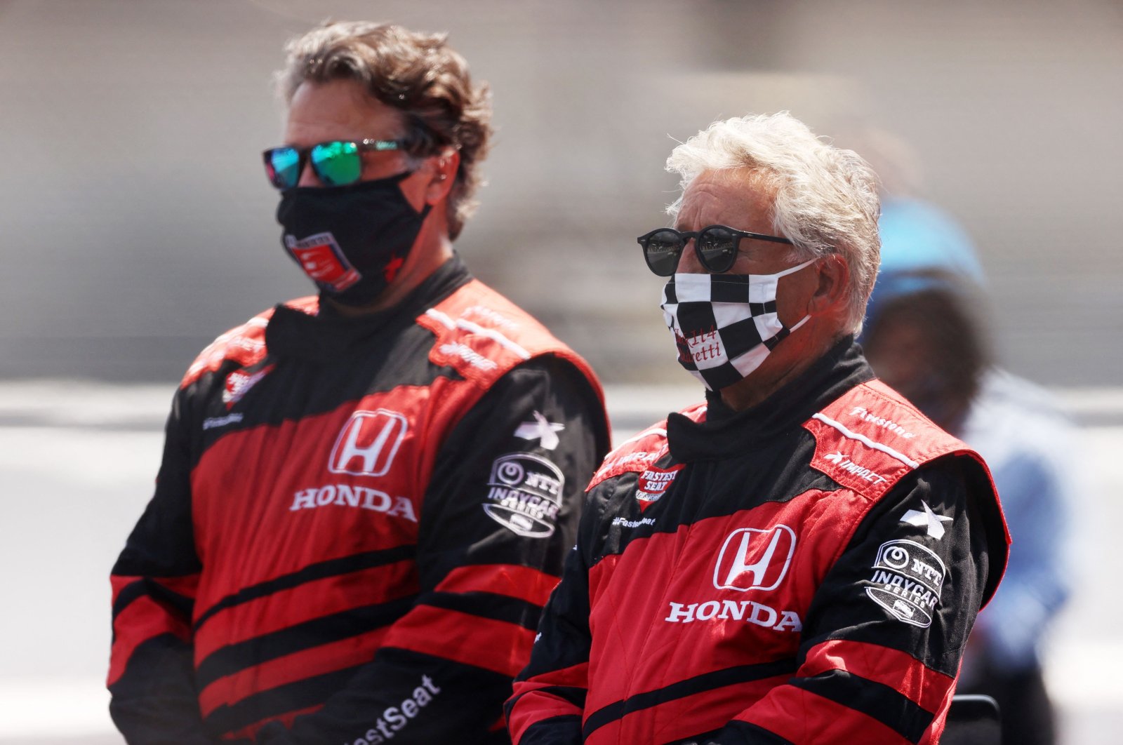 Mario Andretti and his son Michael stands on the grid prior to the 104th running of the Indianapolis 500 at Indianapolis Motor Speedway in Indianapolis, Indiana, US., Aug.23, 2020. (AFP Photo)