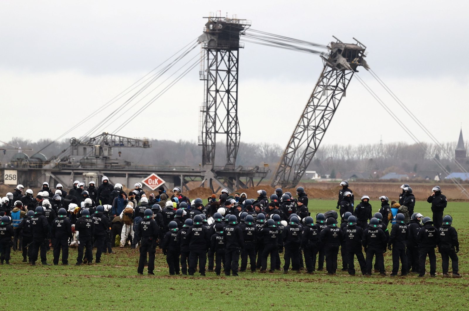 Police keep guard as activists stage a sit-in protest against the expansion of the Garzweiler open-cast lignite mine of Germany&#039;s utility RWE, in Luetzerath, Germany, Jan.11, 2023. (Reuters Photo)