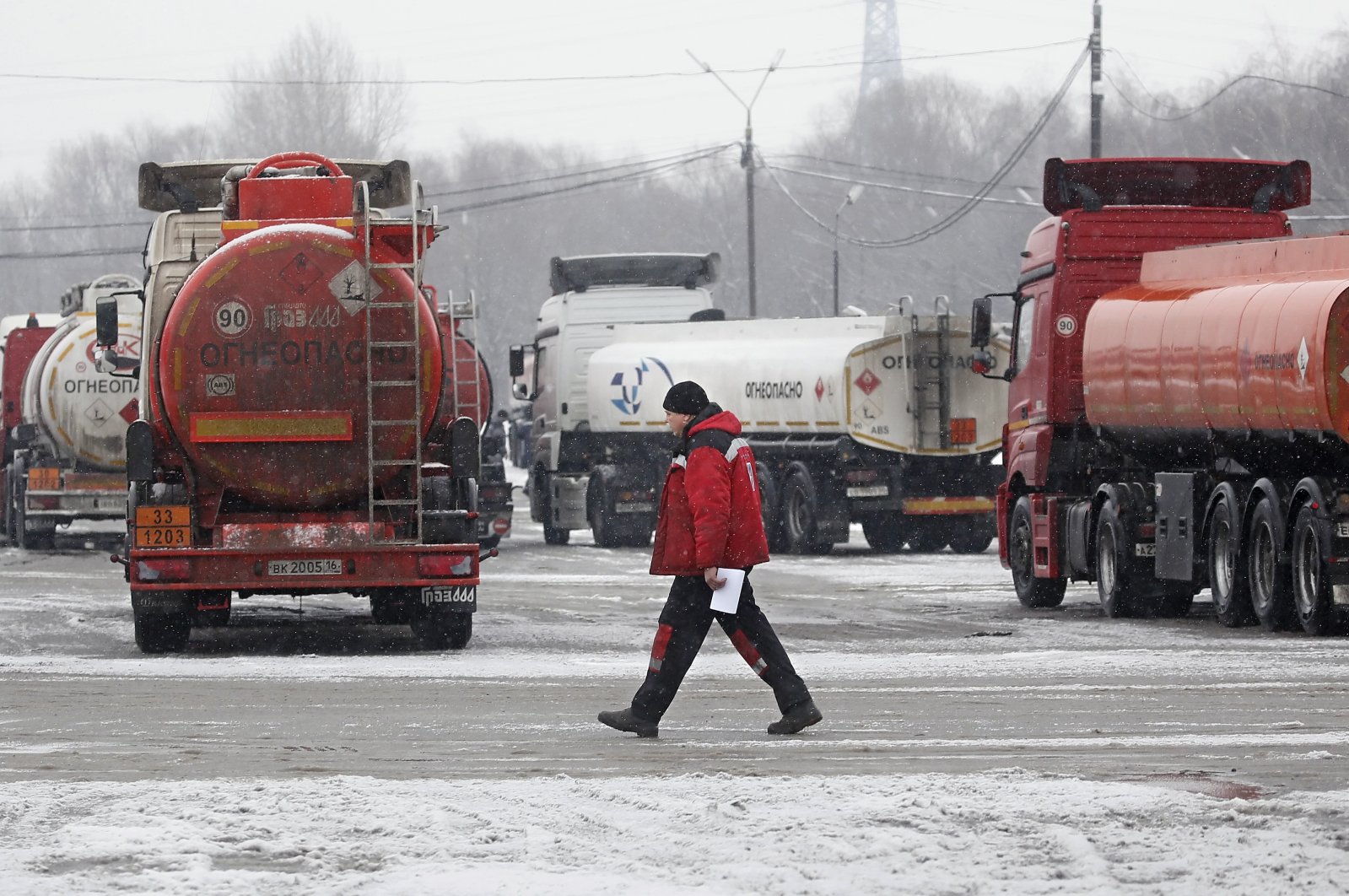 Fuel tankers stand at a parking lot of the Gazprom Neft MNPZ Moscow Petroleum Refinery JSC in Moscow, Russia, Dec. 30, 2022. (EPA Photo)