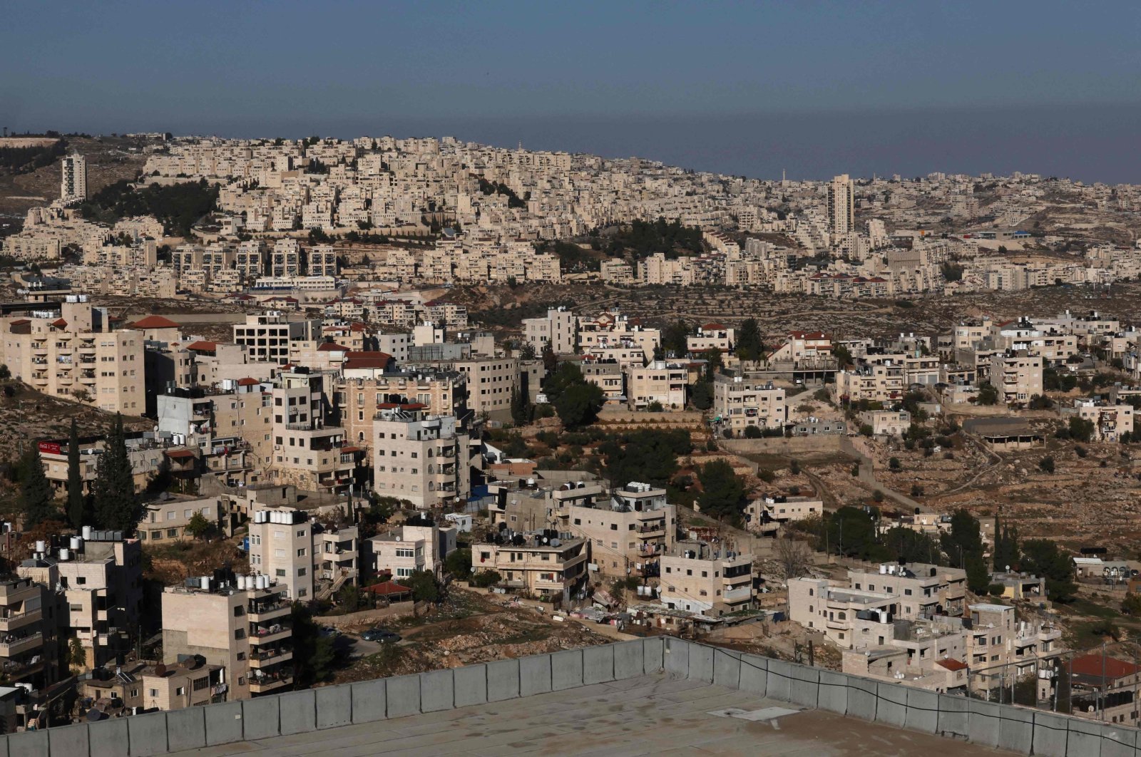 A picture taken from the biblical West Bank city of Bethlehem shows a partial view of the illegal Israeli settlement of Har Homa (background) in the Israel-annexed east Jerusalem, on Dec. 16, 2022. (AFP File Photo)