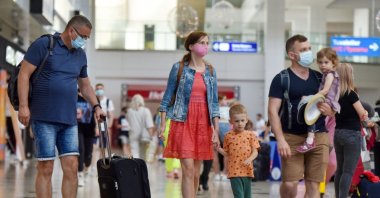 Russian tourists exit the airport as they arrive in Antalya, southern Türkiye, June 29, 2021. (IHA Photo)