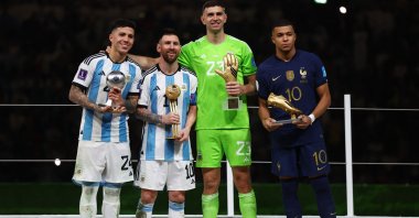 From left, Argentina's Enzo Fernandez, Argentina's Lionel Messi, Argentina's Emiliano Martinez and France's Kylian Mbappe pose after being awarded the Best Young Player, Golden Ball, Golden Glove and Golden Boot, respectively, after the FIFA World Cup Qatar 2022 final match between Argentina and France at Lusail Stadium, Lusail, Qatar, December 18, 2022. (Reuters Photo)