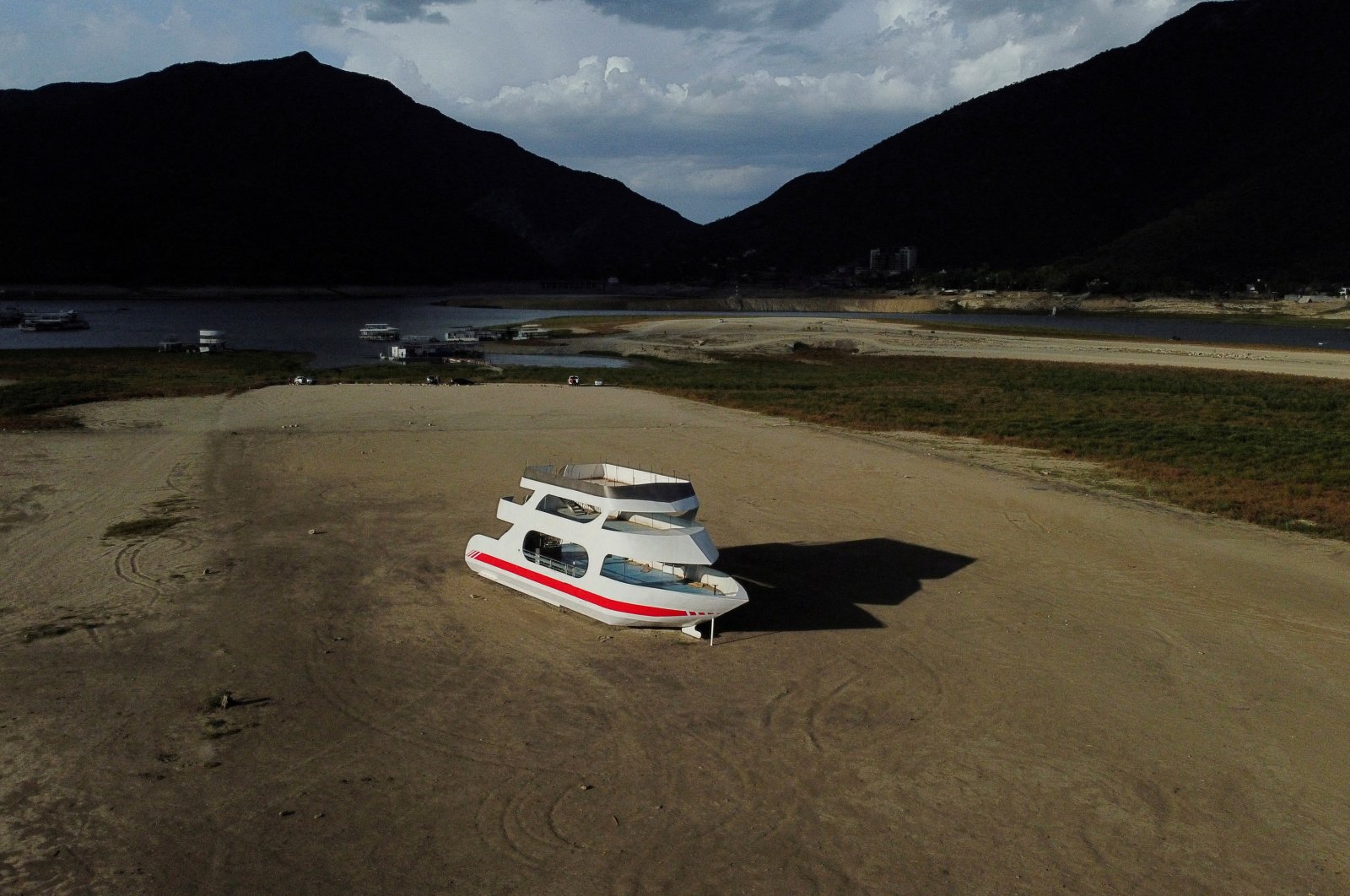 An aerial view shows a boat stranded on the La Boca dam due to a drought in northern Mexico, in Santiago, Mexico, Aug. 8, 2022. (Reuters Photo)