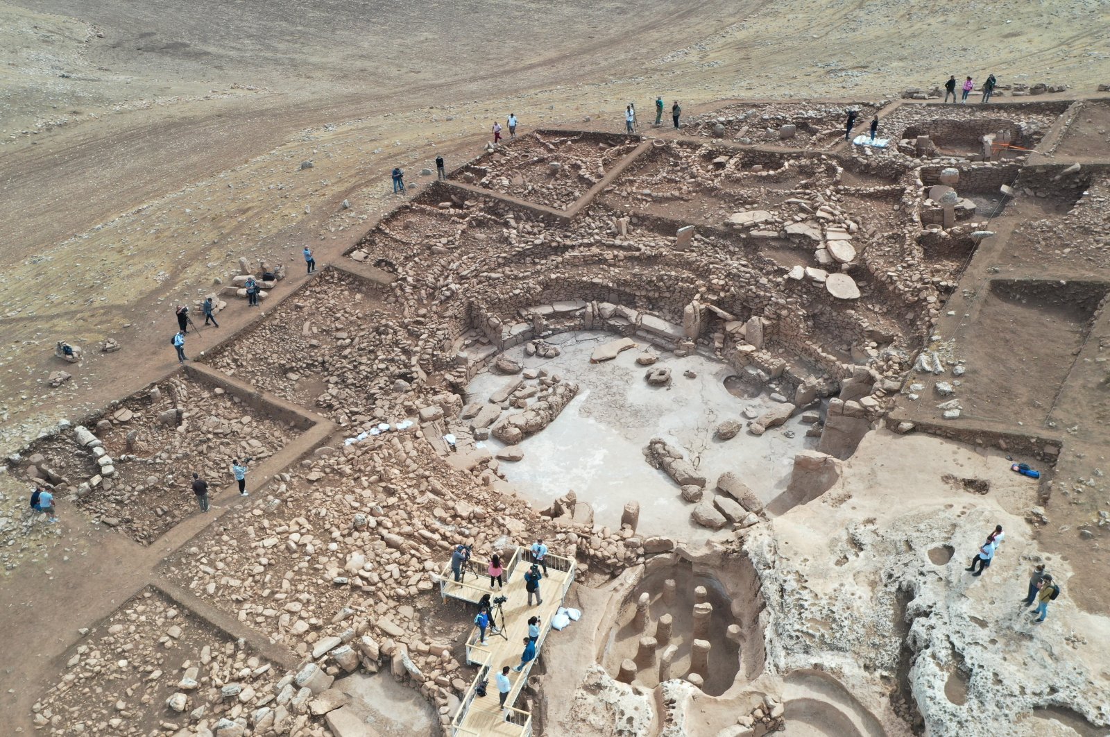 An aerial view of the Göbeklitepe site dating back to about 12,000 years to the Neolithic Age, Şanliurfa, Türkiye, Jan. 1, 2023. (IHA Photo)