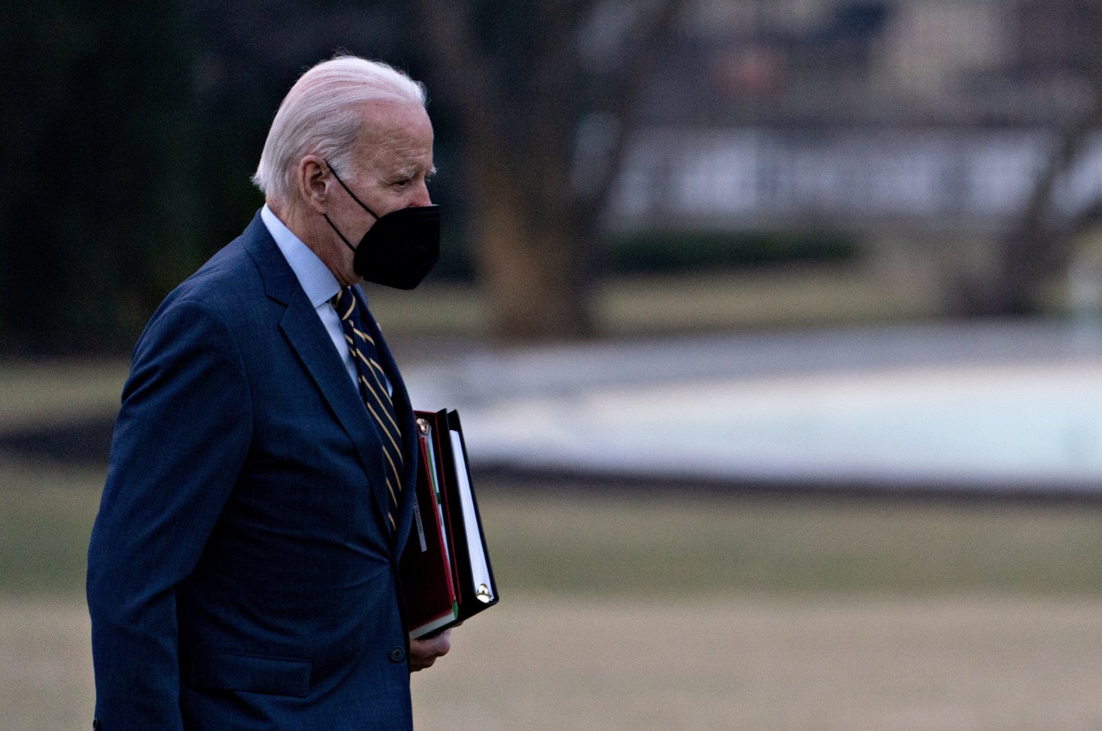 U.S. President Joe Biden walks on the South Lawn of the White House following an arrival on Marine One after accompanying First Lady Jill Biden to Walter Reed National Military Medical Center in Washington, D.C., on Jan. 11, 2023. 