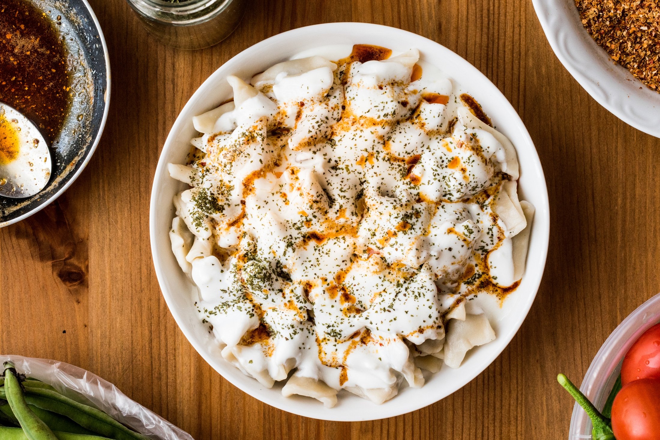 Traditional Turkish mantı with yogurt and butter sauce. (Shutterstock Photo)