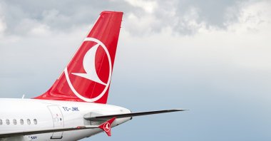 A Turkish Airlines plane cruises amid the clouds. (Shutterstock Photo)
