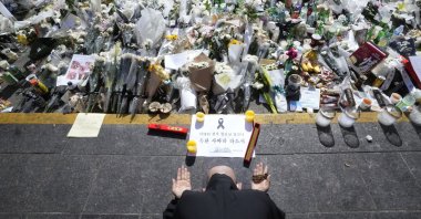 A Buddhist monk prays for the victims of a deadly stampede in Seoul, South Korea, Nov. 2, 2022. (AP Photo)