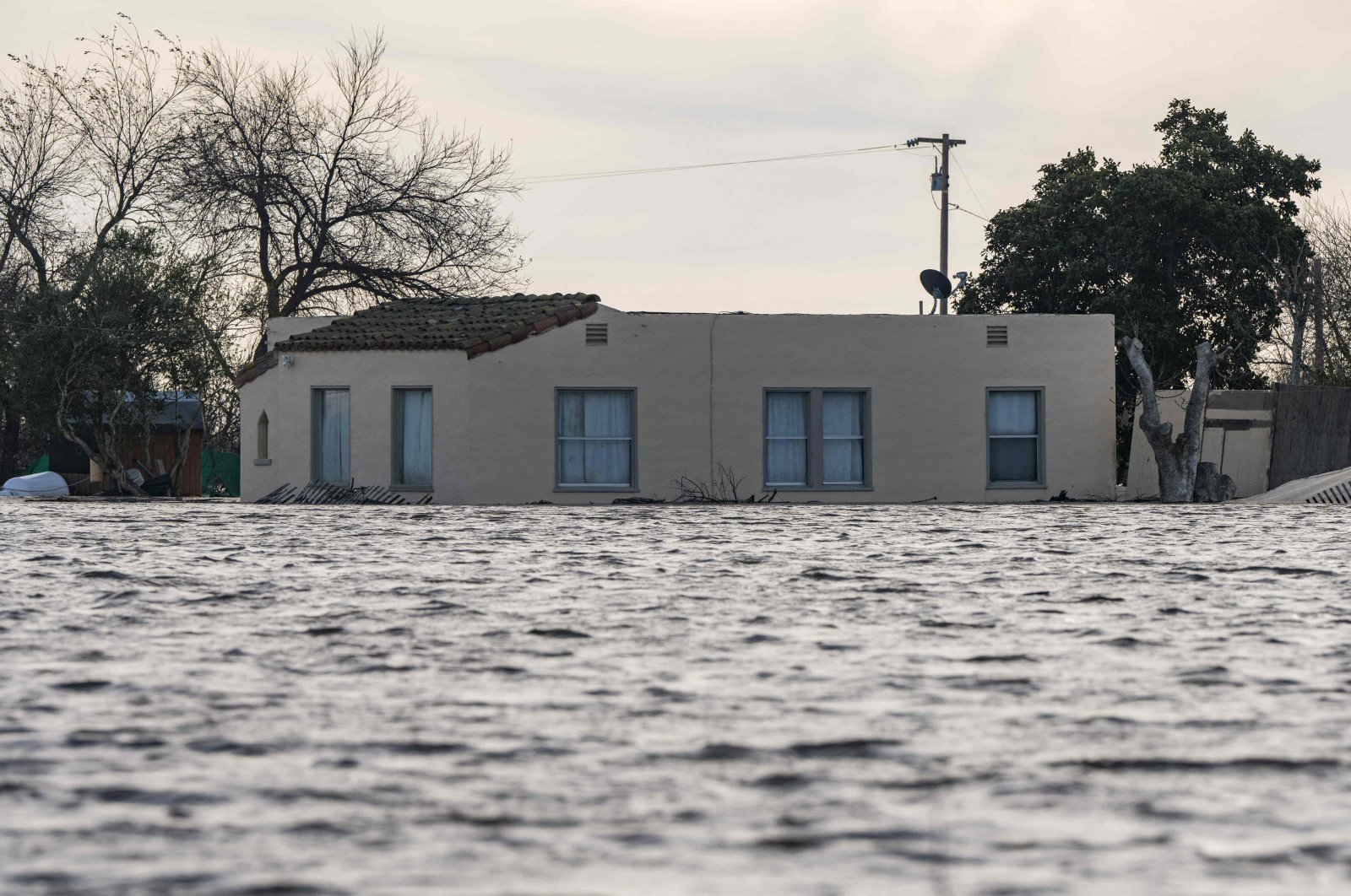 A house is submerged in floodwaters from the Salinas River near Chualar, California, U.S., Jan. 12, 2023. (AFP Photo)