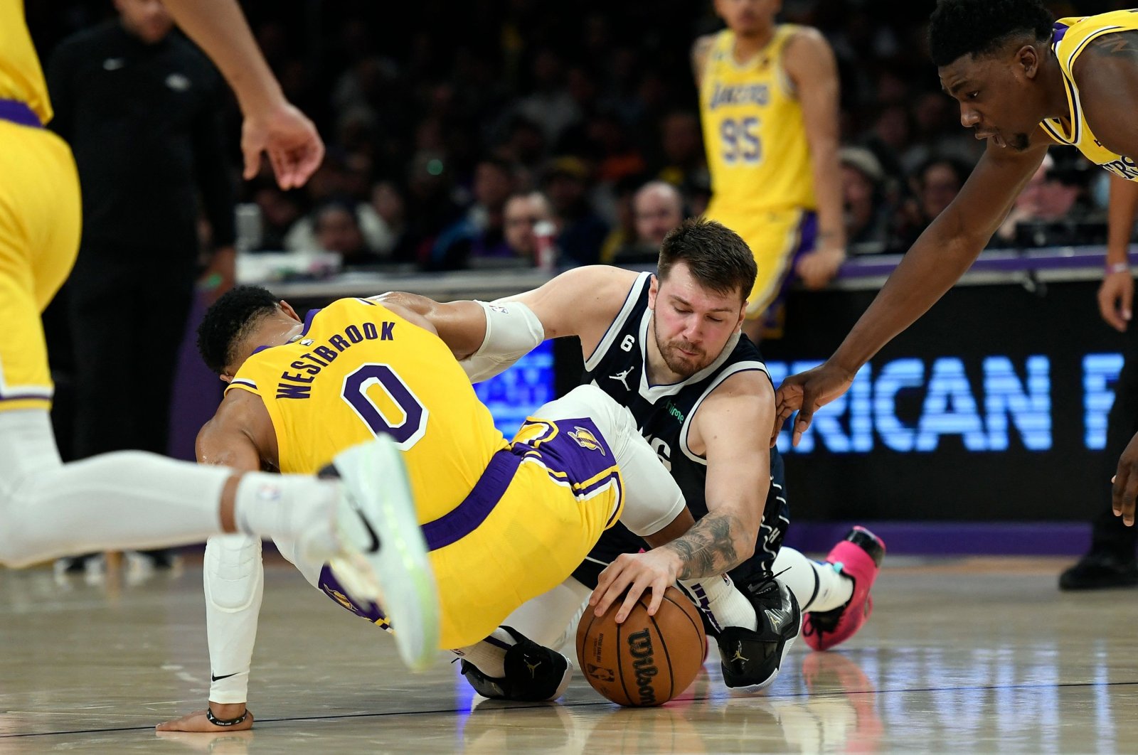 Dallas Mavericks&#039;s Luka Doncic and Los Angeles Lakers&#039; Russell Westbrook battle for the ball during the first half at Crypto.com Arena, Los Angeles, U.S., Jan. 12, 2023. (AFP Photo)