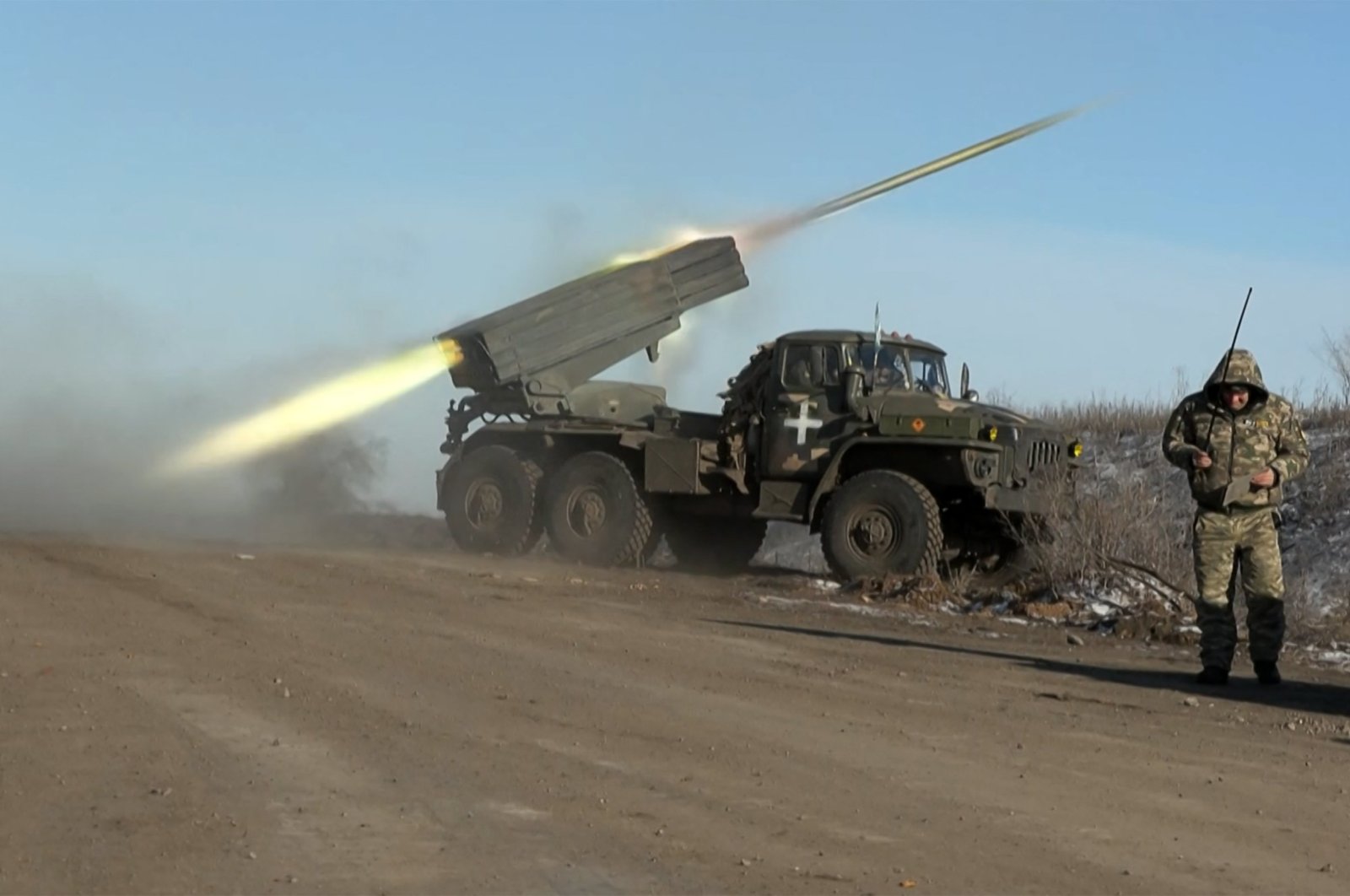 This screengrab shows a member of Ukraine&#039;s military looking away as a BM-21&#039;Grad&#039; rocket launcher fires on the outskirts of Soledar, eastern Ukraine, Jan. 11, 2023. (AFP Photo)