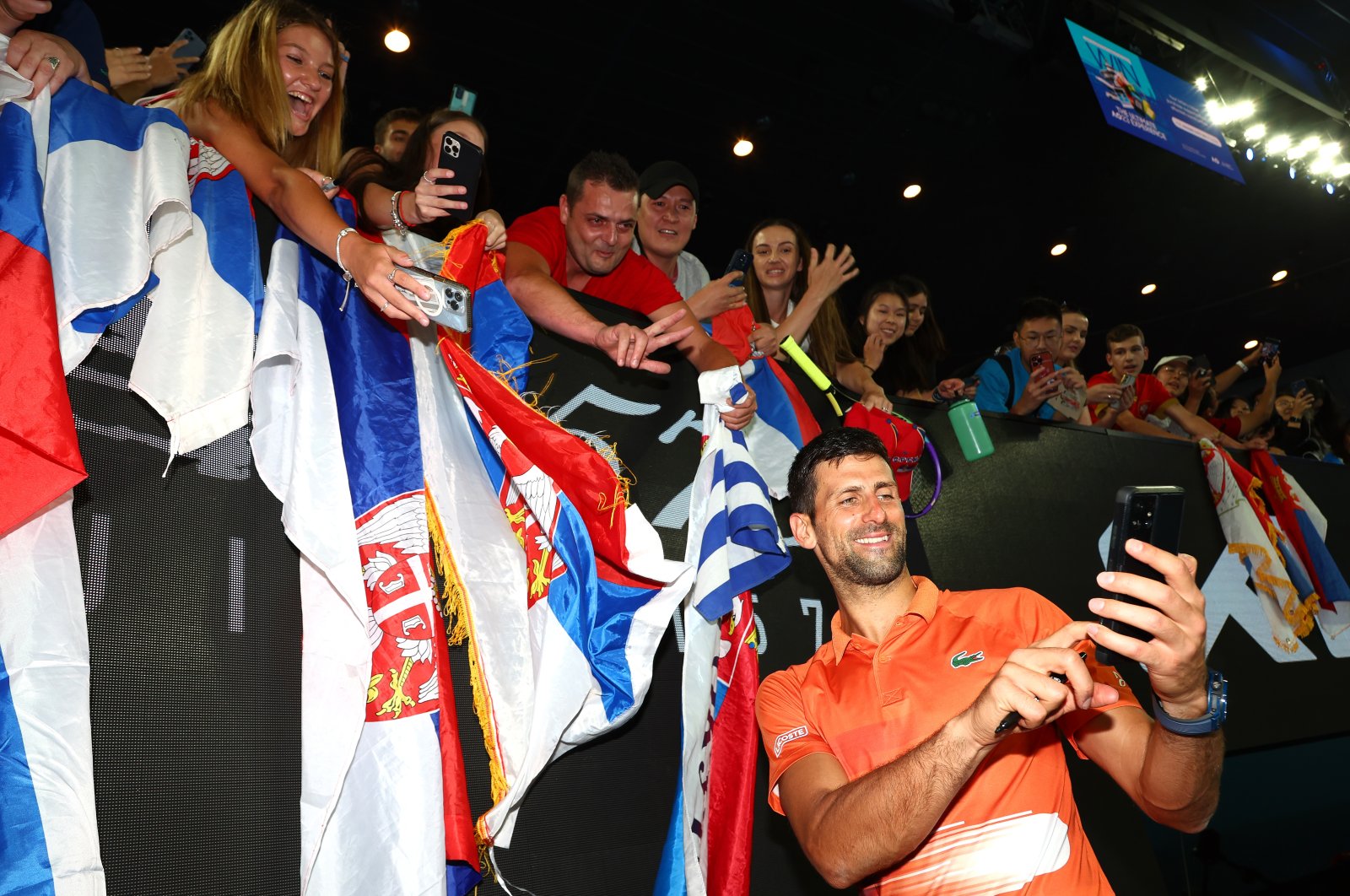 Serbia&#039;s Novak Djokovic poses for a selfie with fans after the Arena Showdown charity match against Nick Kyrgios of Australia ahead of the 2023 Australian Open at Melbourne Park, Melbourne, Australia, Jan.13, 2023. (Getty Images Photo)