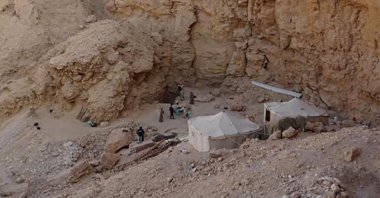 A handout picture released by the Egyptian Ministry of Antiquities on Jan. 14, 2023, shows a view of archaeologists working on the site of a newly-discovered tomb in Egypt's southern province of Luxor. (Photo by Egyptian Ministry of Antiquities / AFP)