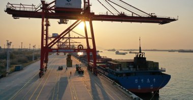 Cranes and cargo ships are seen at Nanjing port in China&#039;s eastern Jiangsu province, Jan. 3, 2023. (AFP Photo)