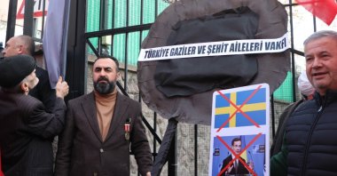 An association of counterterrorism veterans and families of fallen soldiers lay a black wreath at the Swedish Embassy in the capital Ankara, Türkiye, Jan. 13, 2023. (DHA Photo)