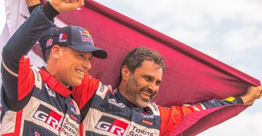Qatari driver Nasser Al-Attiyah (R) and French co-driver Mathieu Baumel of Toyota Gazoo Racing after winning the Dakar Rally 2023, Dammam, Saudi Arabia, Jan. 15, 2023. (EPA Photo)