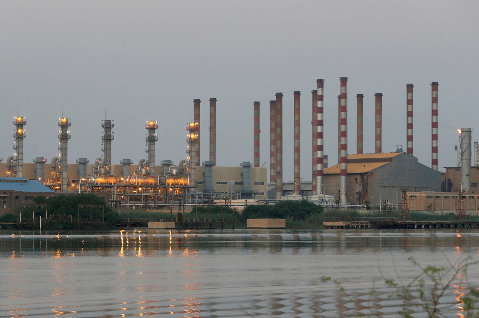 A general view of the Abadan oil refinery in southwest Iran is pictured from the Iraqi side of Shatt al-Arab in Al-Faw south of Basra, Iraq, Sept. 21, 2019. (Reuters Photo)