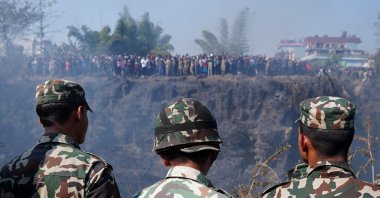 Members of the Nepali Army look toward the crash site of an aircraft, Pokhara, Nepal, Jan. 15, 2023. (Reuters Photo)