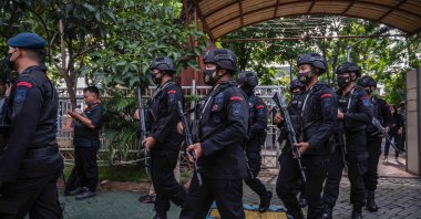 Police take up position outside the Surabaya courthouse ahead of the first trial of the Kajuruhan stadium stampede, Surabaya, Indonesia, Jan. 16, 2023. (AFP Photo)
