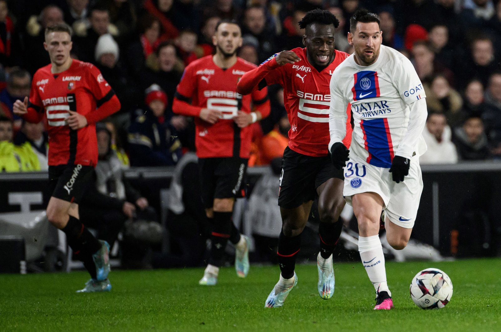Paris Saint-Germain&#039;s Argentine forward Lionel Messi fights for the ball with Rennes&#039; French forward Arnaud Kalimuendo (2nd R) during the French L1 football match between Stade Rennais FC and Paris Saint-Germain (PSG) at the Roazhon Park stadium, Rennes, France, Jan. 15, 2023. (AFP Photo)
