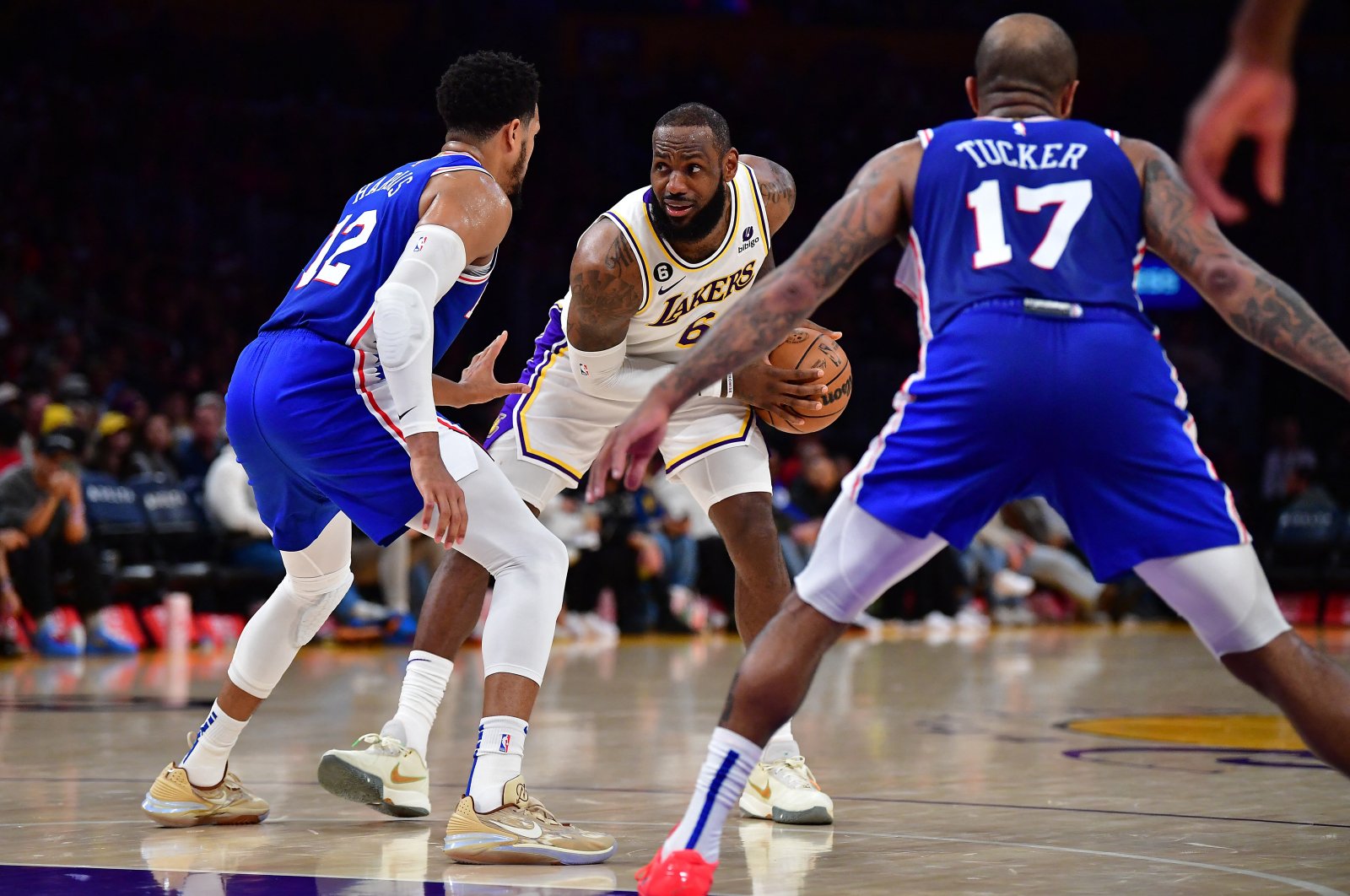 Los Angeles Lakers forward LeBron James (C) controls the ball against Philadelphia 76ers forward Tobias Harris (L) and forward P.J. Tucker (R) during the second half at Crypto.com Arena, Los Angeles, California, USA, Jan 15, 2023. (Reuters Photo)