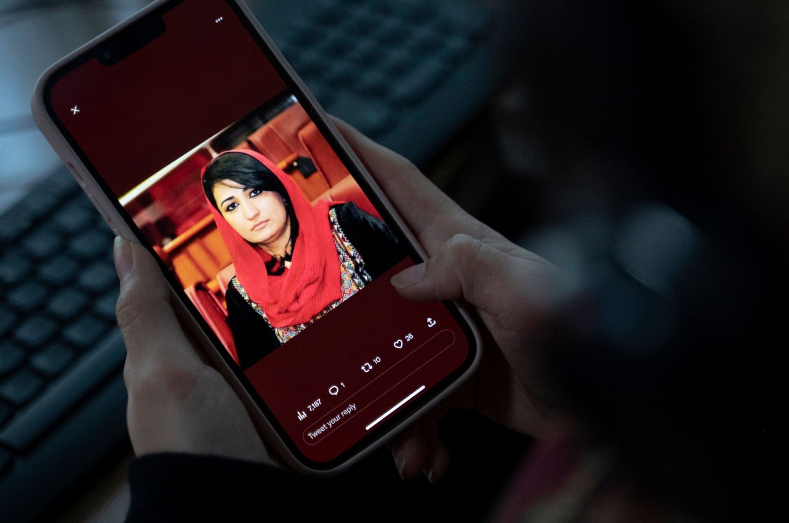 A woman looks at a picture of former Afghan lawmaker Mursal Nabizada on her mobile phone, who was shot dead by gunmen last night at her house in Kabul, Afghanistan, Jan. 15, 2023. (AFP Photo)